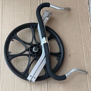 Black and Silver stroller wheel